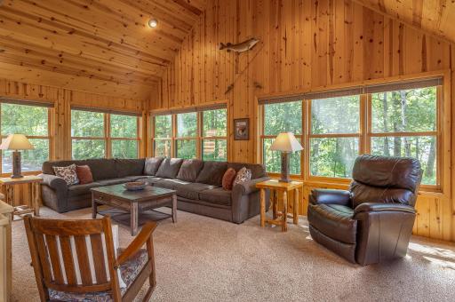 Main floor den with vaulted ceiling and lake views