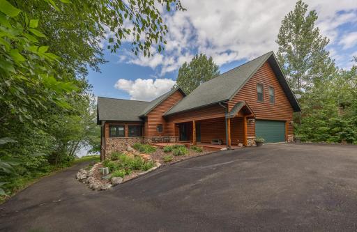 Full asphalt driveways leads you to this home and to shoreline
