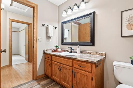 The main floor full bathroom is conveniently located near the three bedrooms.
