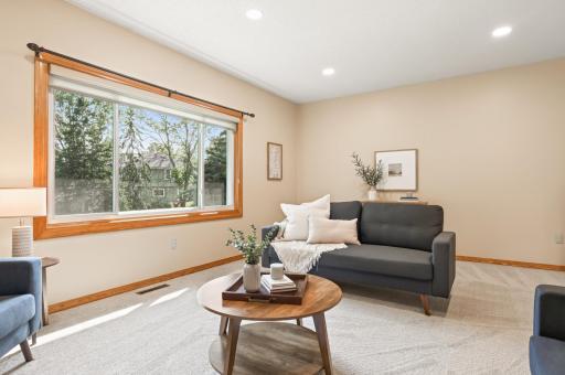 The large window brings in natural light and provides a beautiful view of the large, private backyard.