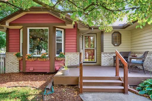 The front exterior sets a welcoming atmosphere with a spacious front deck (with worry-free no maintenance materials) and charming window flower boxes.