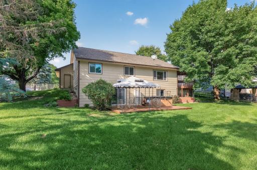 The backyard is fully fenced and equipped with an in-ground sprinkler system for easy maintenance.