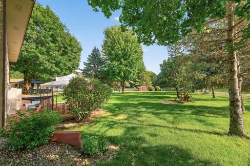 The backyard is fully fenced and equipped with an in-ground sprinkler system for easy maintenance.