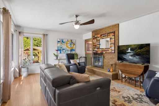 Original hardwood floors and two-sided gas fireplace