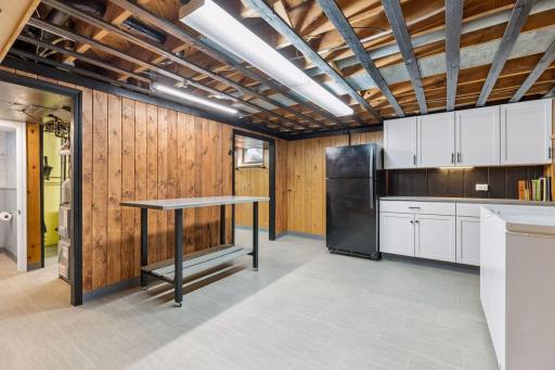 Bonus flex room! Fridge and table included with the home