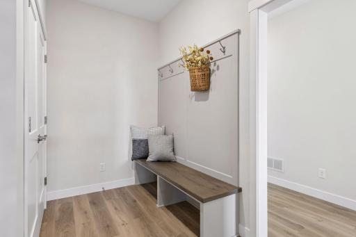 Convenient mudroom with bench and coat hooks