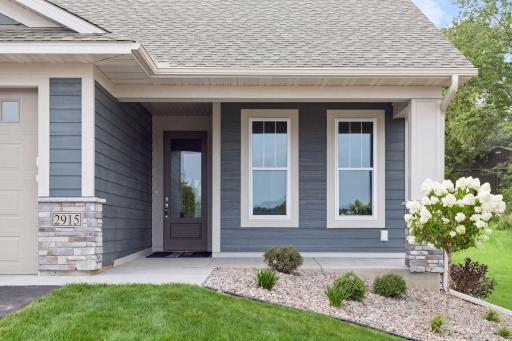 Enjoy a cup of coffee on your cozy front porch