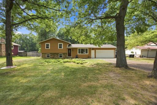 Enjoy a bit of acreage on a beautiful lot in convenient Elk River location.