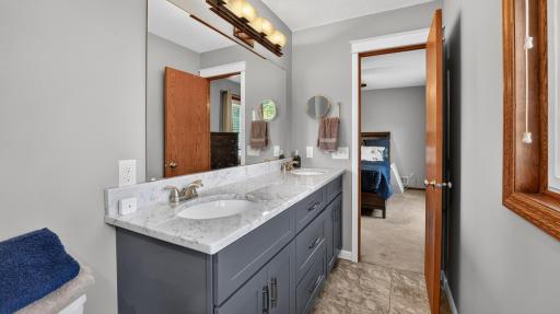 Primary bedroom 3/4 bathroom with double sink.