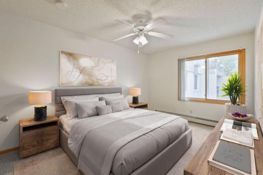 Spacious first bedroom with virtual staging to show just one of your options.