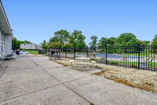 Plenty of picnic tables and chairs at the outdoor pool!