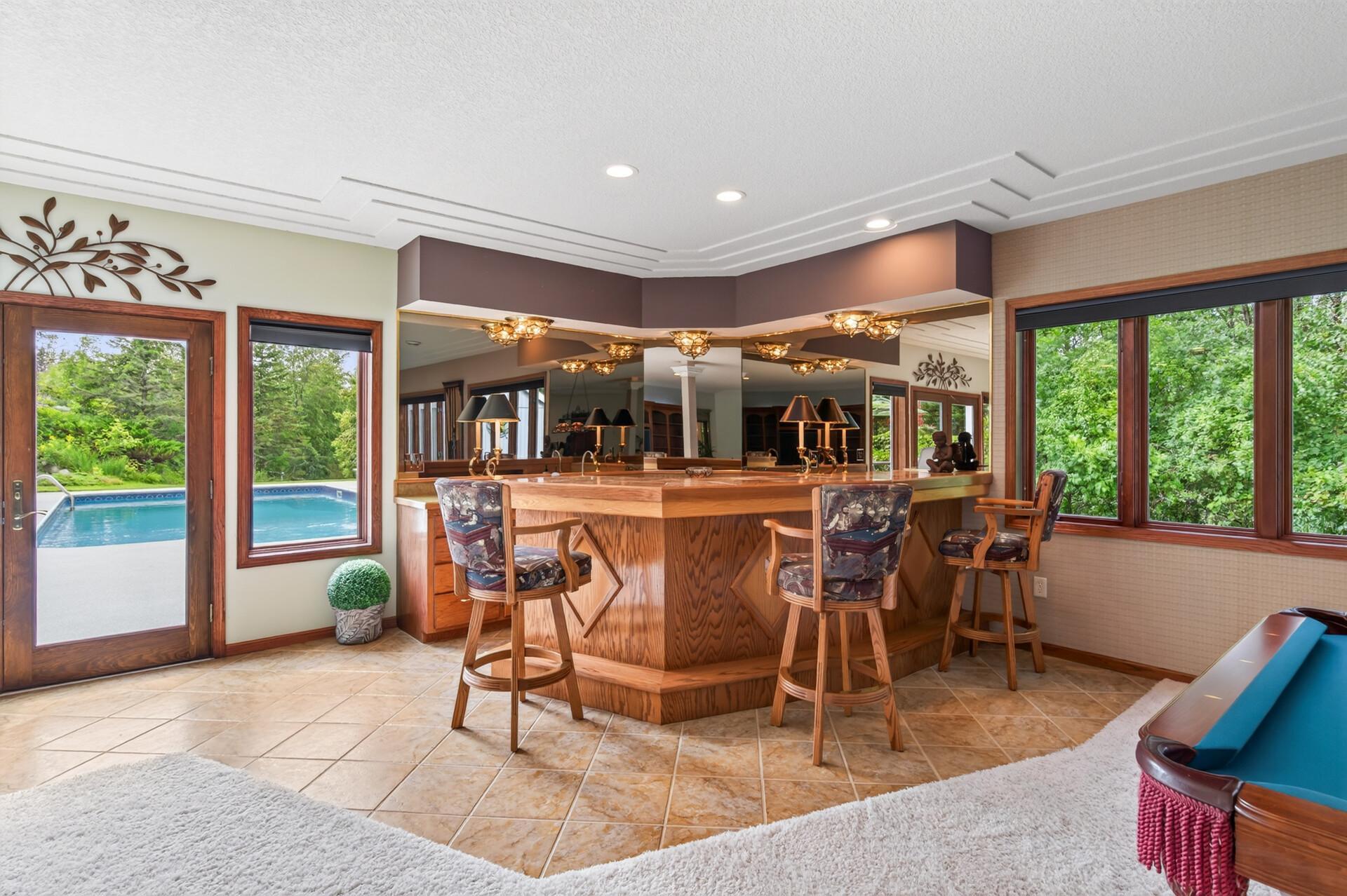 Wet bar with walkout to the pool area