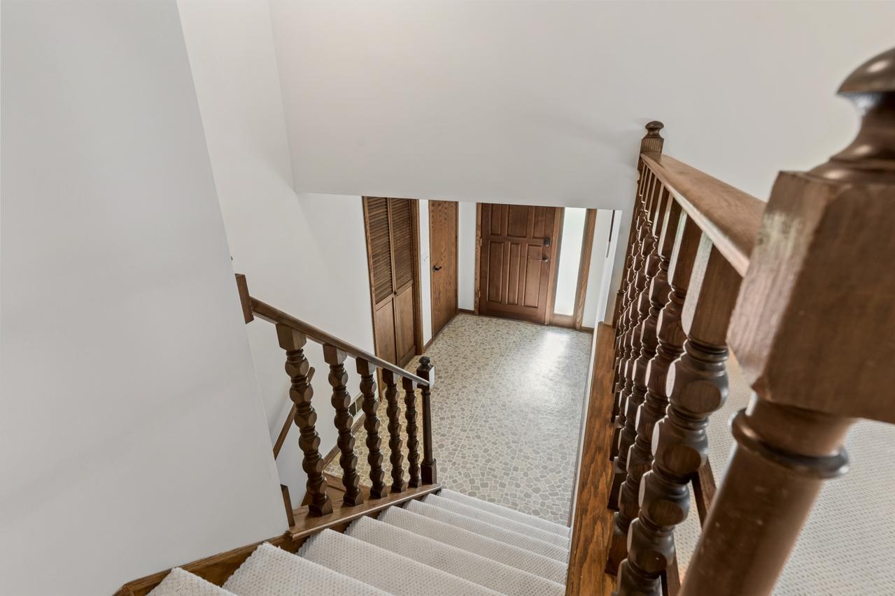 Stairway leading down to the foyer and the spacious lower level.