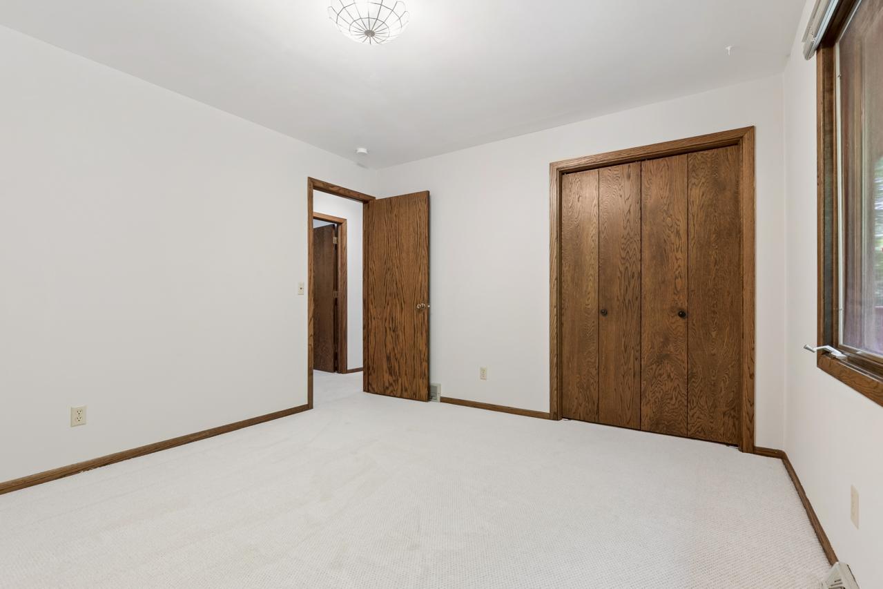 View of the third bedroom closet.