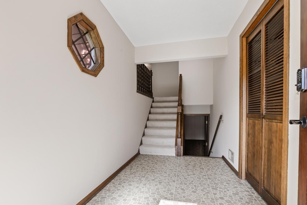 The foyer offers easy access to the garage and features a spacious closet for everyday storage.