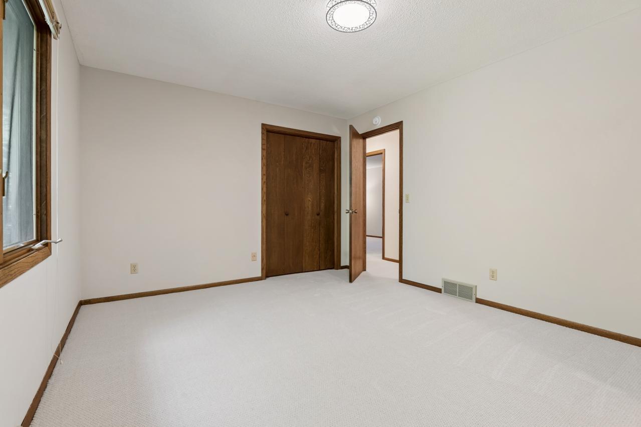The flexible room next to the dining area is ideal for a home office or bedroom, easily accessible from the hallway as well as the dining area.