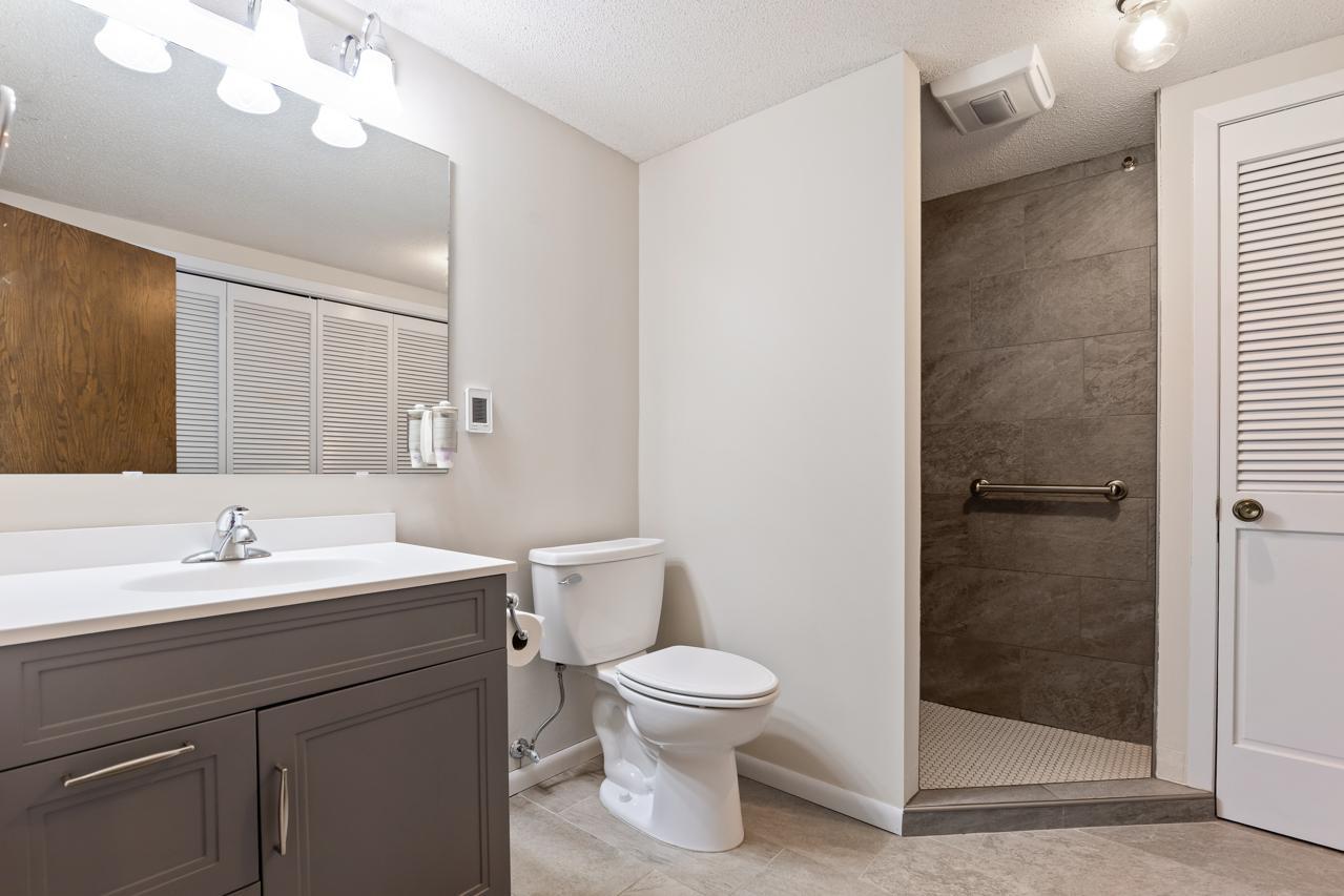 Updated lower-level bathroom featuring heated floors for added comfort.
