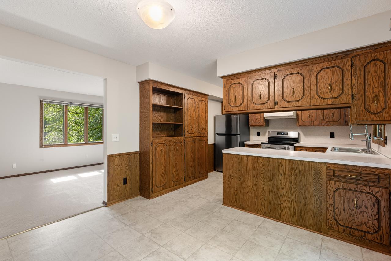 The kitchen features abundant storage and generous counter space for convenience and easy entertaining.