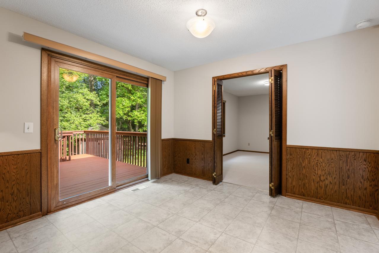 From the dining area, you enter a flexible space perfect for a home office, bedroom, cozy den, or TV room.