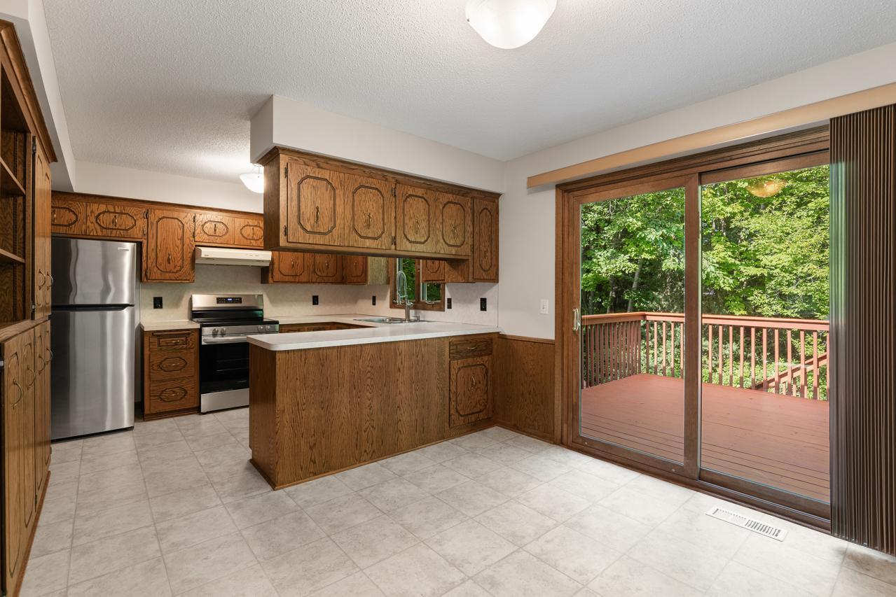 View of the dining area and kitchen on the main level, highlighting the open flow between the two spaces.