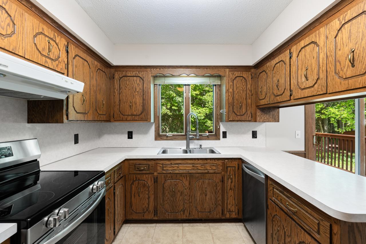 Kitchen has a view of the private backyard.