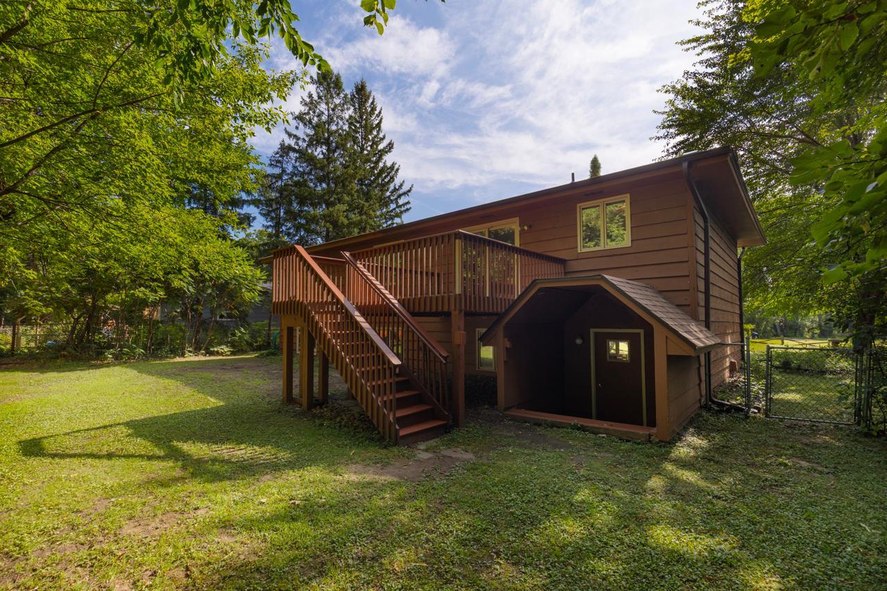 A spacious deck offers peaceful views of the private backyard and is ideal for outdoor entertaining.