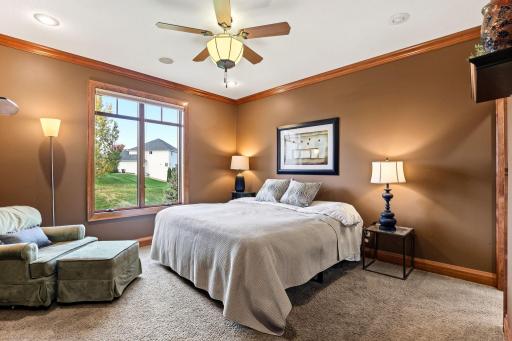 Main floor primary bedroom with crown molding...more details!