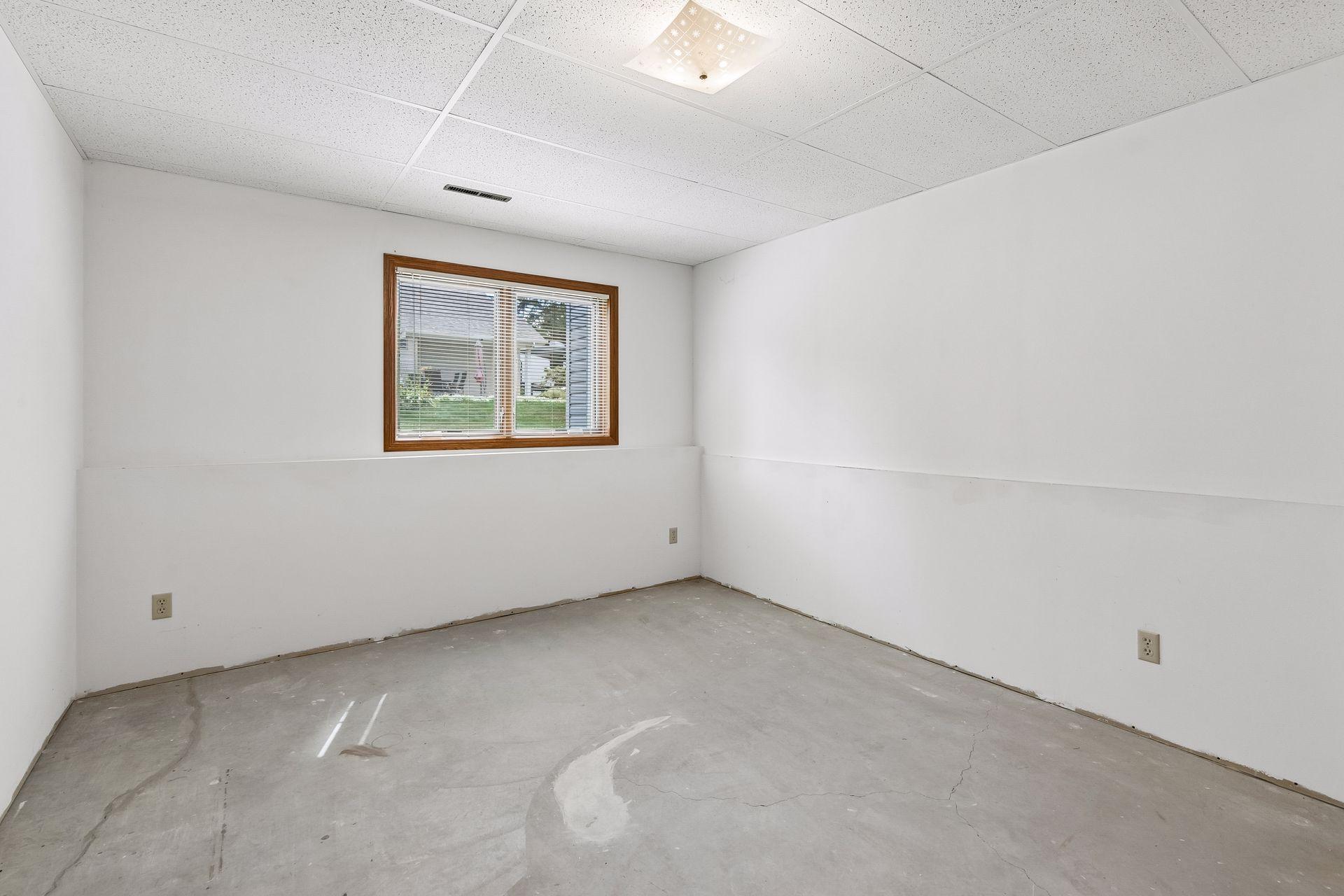 One of two lower level bedrooms. Seller finished but this room has never been used.