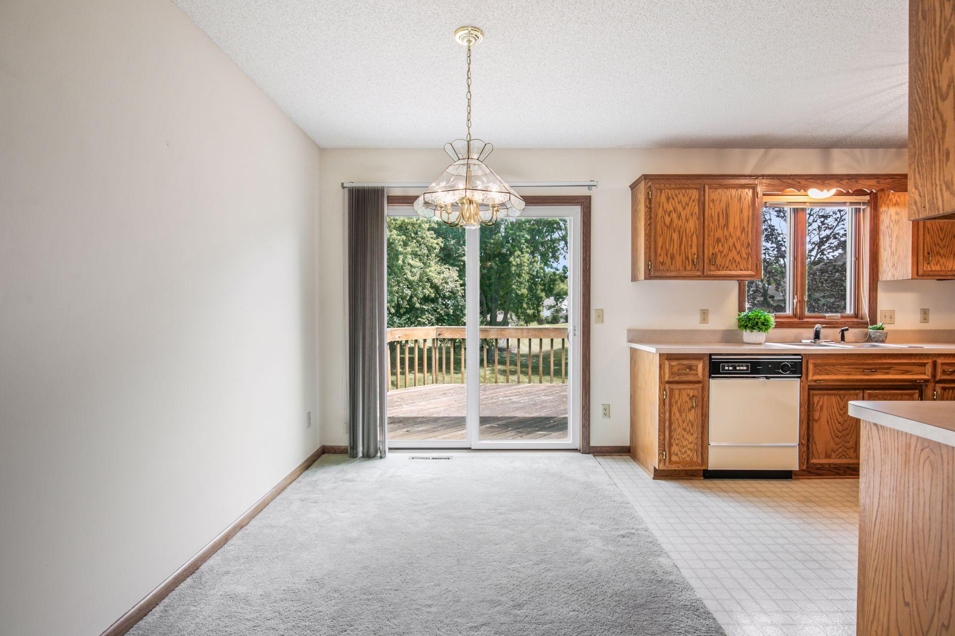 Dining area leads out to the deck. Pella sliding door.