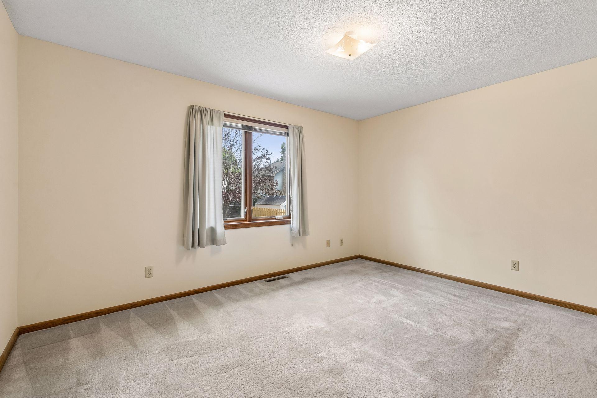 Primary bedroom has views out the back of the home.
