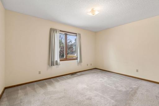 Primary bedroom has views out the back of the home.