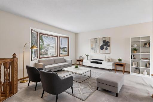 Virtually staged photo of the front living room.