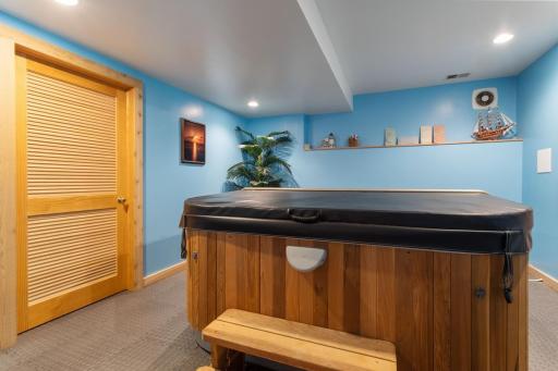 Need another bedroom? A header is already in the wall and ready for a window! This spacious room has French doors, recessed lighting, and an adjacent storage room. Currently being used as a hot tub room. The hot tub can stay but needs repair.