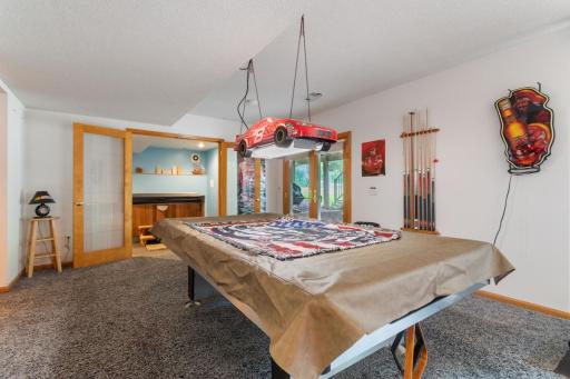 The finished lower level offers plenty of space for a pool table, which stays with the home! Walkout access through French doors provides a great connection to the backyard and makes this level ideal for entertaining.