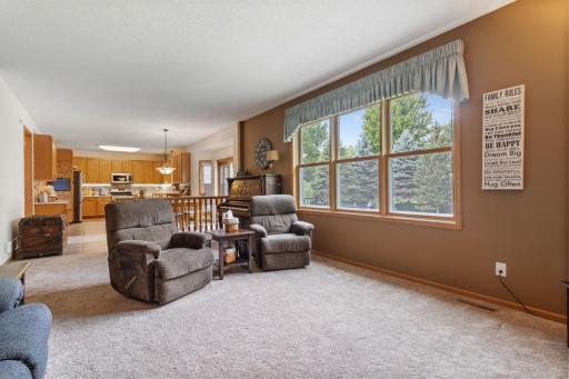 Spacious 21’ x 14’ living room featuring a large picture window overlooking the beautiful treed, fenced backyard. Open to the informal dining room and kitchen, creating a wonderful flow for everyday living and entertaining.