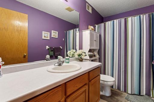 Convenient hall bath serves the upper-level bedrooms. A spacious loft landing just outside overlooks the dramatic vaulted foyer, creating an open, airy feel and a beautiful connection between the upper and main levels.