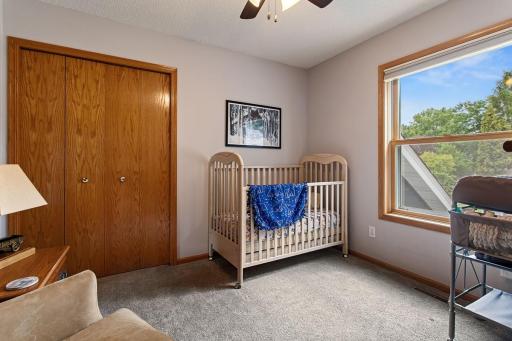 Upper level , south facing bedroom with ceiling fan and nice sized closet.