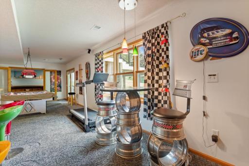 Light and bright, this finished walkout lower level feels anything but basement-like! French doors open to the patio, backyard and fire pit, with convenient access to the beautiful deck for easy outdoor entertaining.