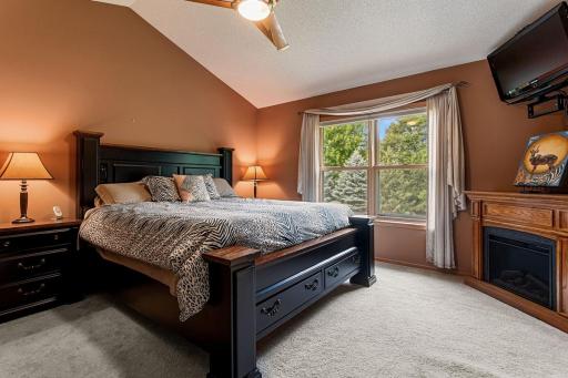Four bedrooms on one level! The spacious primary bedroom has vaulted ceilings, a ceiling fan and beautiful backyard views. The impressive 11’ x 6’ walk-in closet offers abundant shelving and storage, creating a comfortable and organized retreat.