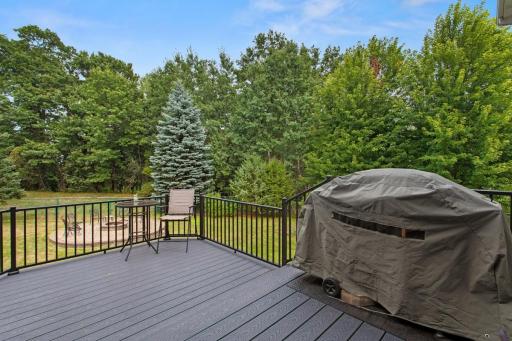 2022-built two-tier deck with maintenance-free Trex Select decking & aluminum rails. Upper 11’x7’ deck connects to a new screened porch; lower 9’x11’ level is perfect for entertaining, with stairs to the fenced backyard.