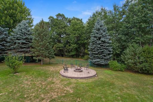 Enjoy the privacy of this beautifully designed 16-foot raised paver fire pit area, installed in 2021 and tucked away in the backyard. Perfect for relaxing evenings, entertaining guests, and gathering around the fire under the stars.