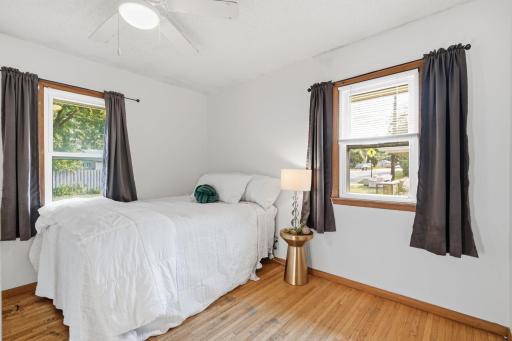 The largest of the main level bedrooms, bedroom #3 glows with light and overlooks the back yard.