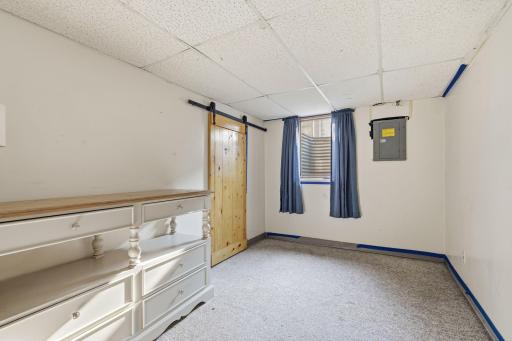 The large lower level 4th bedroom glows with lots of light and is conveniently located by the 2nd 3/4 bathroom and the laundry area