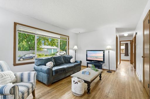 Wood floors run throughout the main level.
