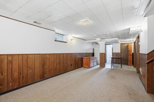 The lower level living area includes an area which has been previously used as a mini-kitchen and gaming area.
