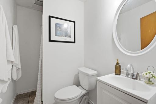The main floor bathroom is located by the bedrooms and living room and features a shower.