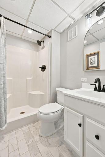 There is a 3/4 bathroom on the lower level with a walk-in shower.