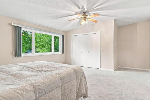 Primary bedroom with view of outdoors