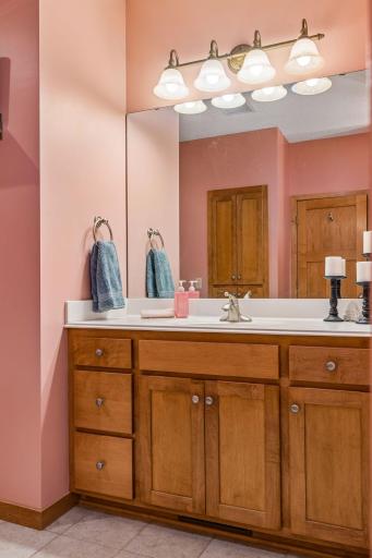Cultured marble vanity and built-in maple cabinetry.