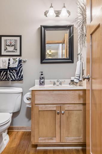Main floor 1/2 bath for guests. Built-in vanity with cultured marble stone.